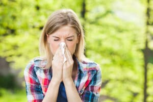 Female sneezing from allergies