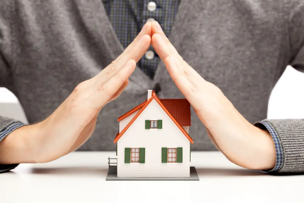Hands,As,A,Protecting,Roof,Over,A,Little,House,Over