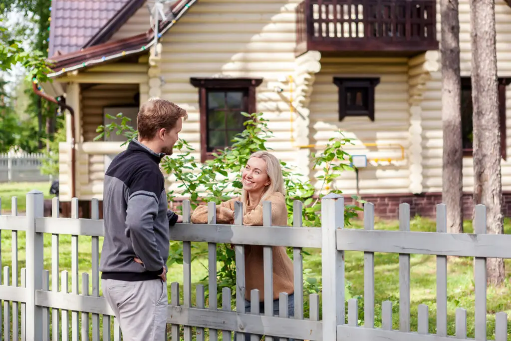 Middle,Aged,Man,Meeting,Smiling,Female,Neighbor,In,Countryside,And